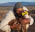 Man hugging and playing with his dog Royalty Free Stock Photo