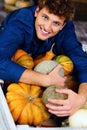 man hugging pumpkins Royalty Free Stock Photo