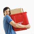 Man hugging recycling bin. Royalty Free Stock Photo