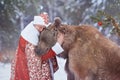 Man hugs brown bear in Christmas eve