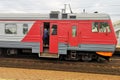 The man hung out through the open doors of the train