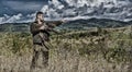 Man hunter aiming rifle nature background. Experience and practice lends success hunting. Guy hunting nature environment Royalty Free Stock Photo