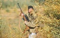 Man hunter with rifle gun. Boot camp. Military uniform fashion. Bearded man hunter. Army forces. Camouflage. Hunting Royalty Free Stock Photo