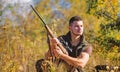 Man hunting wait for animal. Hunter with rifle ready to hunting nature background. Hunting strategy or method for