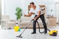 The man husband cleaning the house helping wife Royalty Free Stock Photo