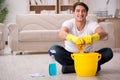 The man husband cleaning the house helping wife Royalty Free Stock Photo