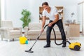 The man husband cleaning the house helping wife Royalty Free Stock Photo