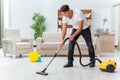 The man husband cleaning the house helping wife Royalty Free Stock Photo