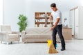 The man husband cleaning the house helping wife Royalty Free Stock Photo