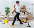 Man husband cleaning the house helping wife Royalty Free Stock Photo