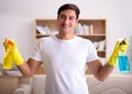 Man husband cleaning the house helping wife Royalty Free Stock Photo