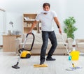 Man husband cleaning the house helping wife Royalty Free Stock Photo