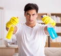 Man husband cleaning the house helping wife Royalty Free Stock Photo