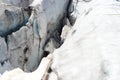 Man is ice climbing in a crevasse of glacier Pasterze at icefall Hufeisenbruch in Glockner Group, Austria Royalty Free Stock Photo