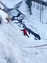 Man ice climbing and smiling in the Swiss Alps