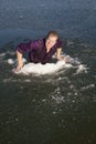 Man in ice hole climb out