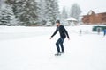 Man ice skating outdoors Royalty Free Stock Photo