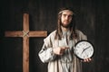 Man in the image of Jesus Christ shows on clock Royalty Free Stock Photo