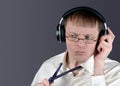 Man indignantly listens to music through headphones Royalty Free Stock Photo