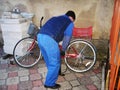 a man inflates a bicycle wheel pump Royalty Free Stock Photo