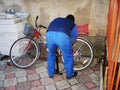 a man inflates a bicycle wheel pump Royalty Free Stock Photo