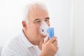 Man Inhaling Through Oxygen Mask