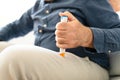 Man Injecting Epinephrine Using Auto-injector Syringe