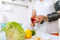 Man with injured hand making salad