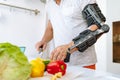 Man with injured hand making salad