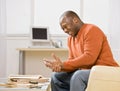 Man injures himself while constructing wooden shelf Royalty Free Stock Photo