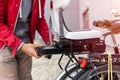 Man inserting battery in backseat of electric bicycle