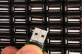 Man inserts USB flash drive in one of many sockets Royalty Free Stock Photo
