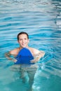 Man inside the pool with floater Royalty Free Stock Photo
