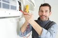 man inspecting air conditionning machine Royalty Free Stock Photo