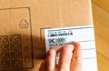 Man inspecting barcode of APC Smart-UPS SMC 1000VA