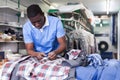 Man inspecting clothing after dry cleaning