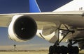 Man inspecting engine of passenger jet