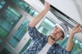 man install suspended ceiling in house Royalty Free Stock Photo