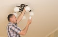 Man installing bulb Royalty Free Stock Photo