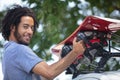 man installing car roof rack outdoors Royalty Free Stock Photo