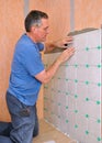 Man installing ceramic tile Royalty Free Stock Photo
