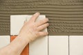 Man installing ceramic tile Royalty Free Stock Photo