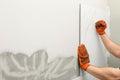 Man installing ceramic tile on wall, space for text. Royalty Free Stock Photo