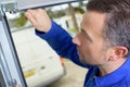 Man installing garage door Royalty Free Stock Photo