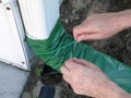 Man Installing Gutter Downspout Retractable Extender