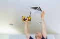 Man installing of HVAC, heating ventilating and cooling after replacing the air filter. Royalty Free Stock Photo