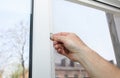 Man is installing the mosquito net on the window. Protection from bugs Royalty Free Stock Photo