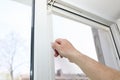 Man is installing the mosquito net on the window. Protection from bugs Royalty Free Stock Photo