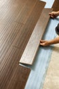 Man Installing New Laminate Wood Flooring Royalty Free Stock Photo