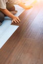 Man Installing New Laminate Wood Flooring Royalty Free Stock Photo